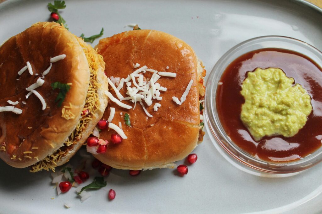 Top view of spicy Indian street food burgers served with flavorful chutney dips.
