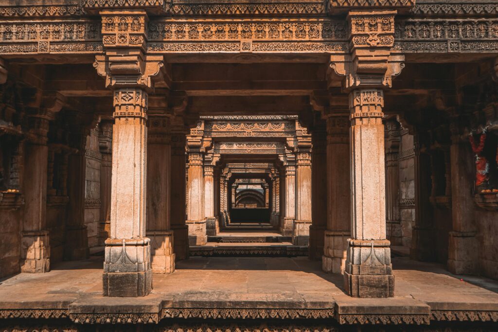 Explore the ornately carved columns of Adalaj Stepwell in Gujarat, India.